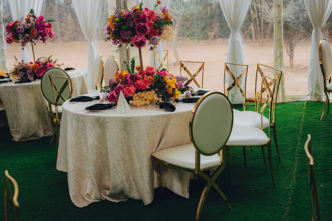 Elegant tables set with colorful floral arrangements for an event.