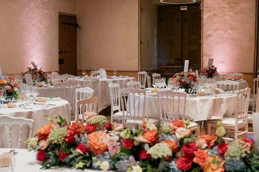 Wedding reception tables with floral centerpieces