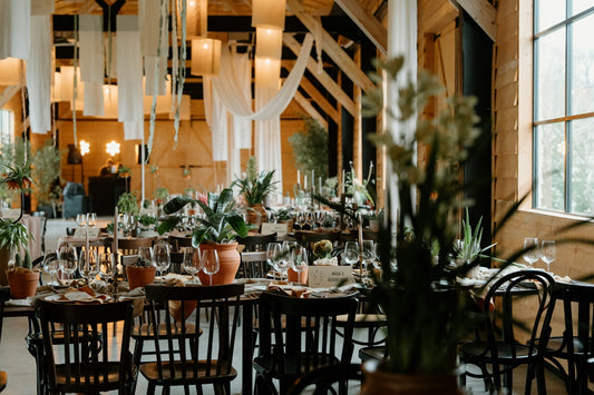 Elegant wedding reception tables with floral centerpieces