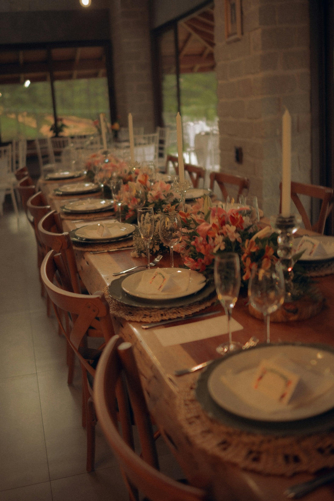 Elegant long dining table set for a formal event.