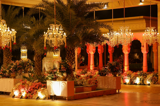 Elegant wedding venue with chandeliers and floral arrangements